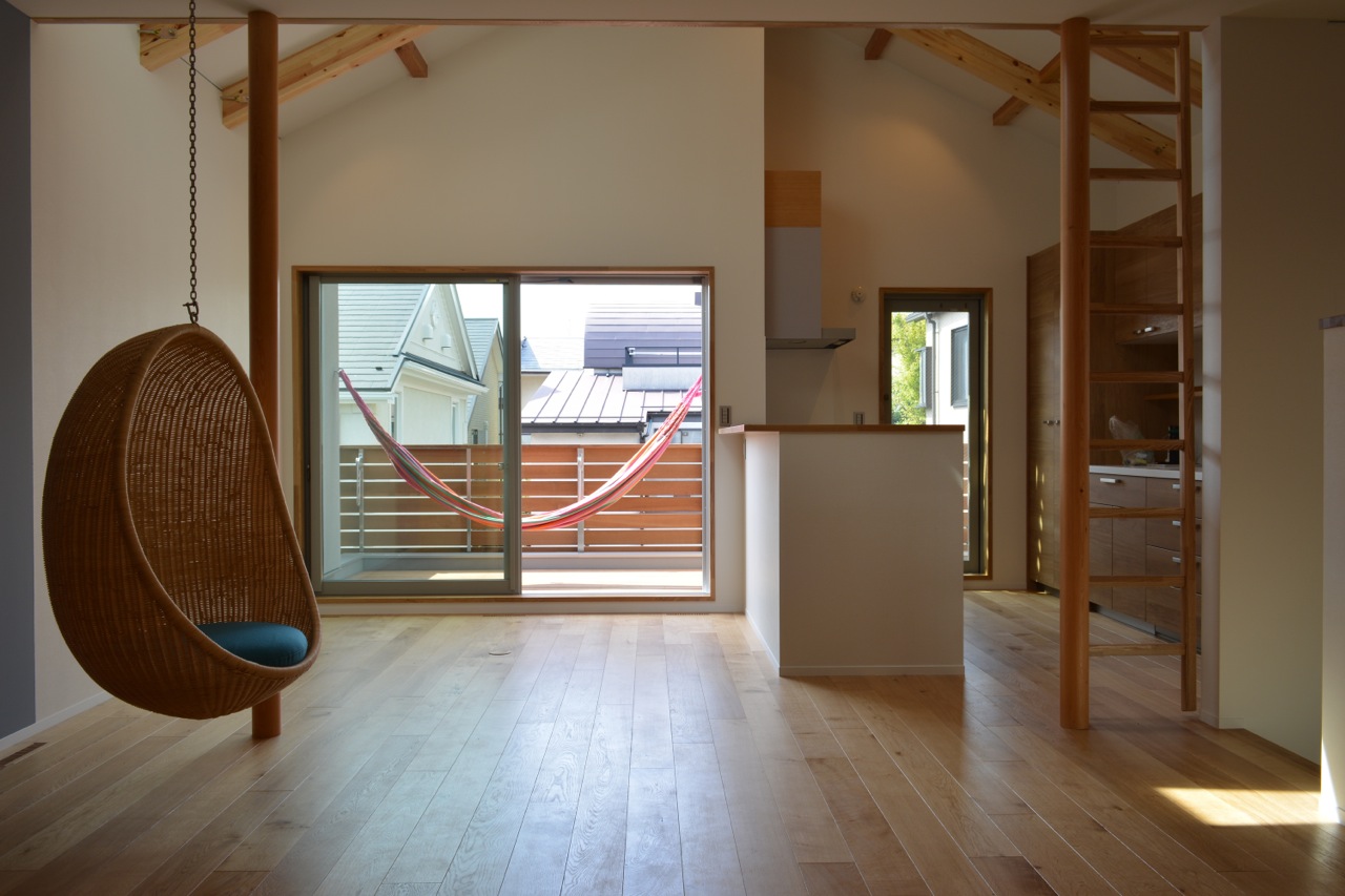 View of the dining and kitchen area with hanging chair.   View of the dining and kitchen area with hanging chair.
